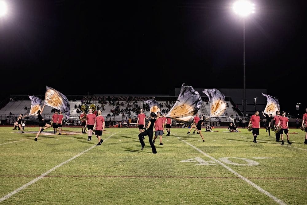 Desert Ridge marching band performing at a home football game