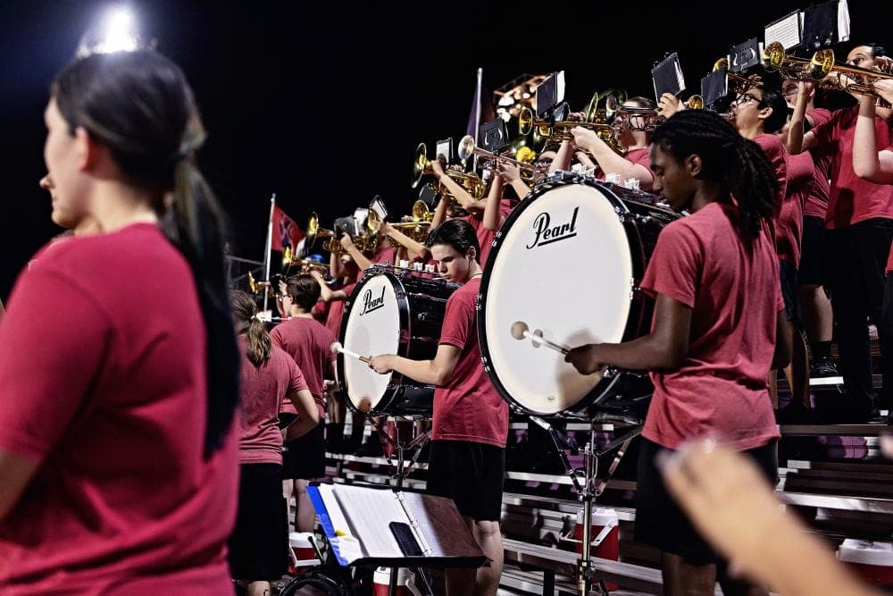 Desert Ridge marching band performing at a home football game